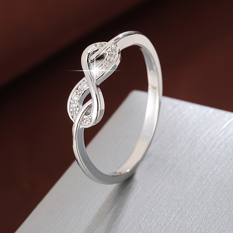Golden Tone Infinity Symbol Ring with Zirconia Stones